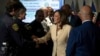 Democratic presidential candidate Vice President Kamala Harris greets first responders after receiving a briefing on Hurricane Beryl recovery efforts at the City of Houston Emergency Operation Center in Houston, Texas, July 24, 2024.