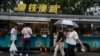 People visit a roadside food stall in Beijing, July 25, 2024.