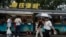 People visit a roadside food stall in Beijing, July 25, 2024.