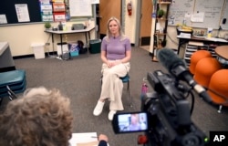 Heather Martin is interviewed in Aurora, Colorado, April 11, 2024. Martin, a survivor of the 1999 shooting at Columbine High School in suburban Denver, hid with 60 other students in a barricaded office during the attack.