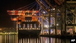 FILE - A container ship is docked at the Port of Los Angeles, Nov. 21, 2022. The shipping industry produces about 3% of the world's total carbon emissions.