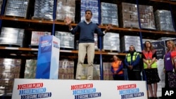 British Prime Minister Rishi Sunak speaks to staff members as he visits the DCS group distribution center as part of a Conservative general election campaign event, in Banbury, Britain, July 2, 2024.