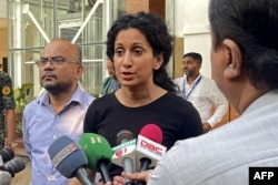 US Deputy Assistant Secretary Afreen Akhter (center) speaks to the media outside the office of the Refugee Assistance and Repatriation commissioner in Coxs Bazar, October 17, 2023. (Tanbir MIRAJ/AFP)