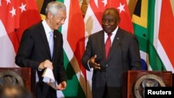South African President Cyril Ramaphosa, R, and Singapore Prime Minister Lee Hsien Loong attend a media briefing and signing ceremony at Tuynhuys in Cape Town, South Africa, May 16, 2023.