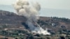 A smoke plume billows during Israeli bombardment on the village of Khiam in south Lebanon near the border with Israel on June 26, 2024.