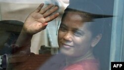 Cambodia union leader Chhim Sithar waves to supporters as she leaves Phnom Penh Municipal Court in Phnom Penh on May 25, 2023.