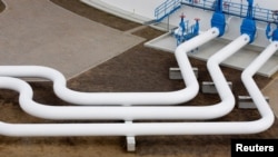 FILE - A view shows pipelines at an oil pumping station of Druzhba pipeline, in Adamowo, Poland, June 14, 2011.