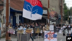 Right-wing extremists gather on a street in central Belgrade, Serbia, June 27, 2024. Serbian police banned a festival that promotes cultural exchange with Kosovo, in a sign of growing nationalism and government pressure on liberal voices in the Balkan country. 