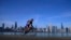 A cyclist pedals around Lake Michigan near the Adler Planetarium, Feb. 26, 2024, in Chicago. 