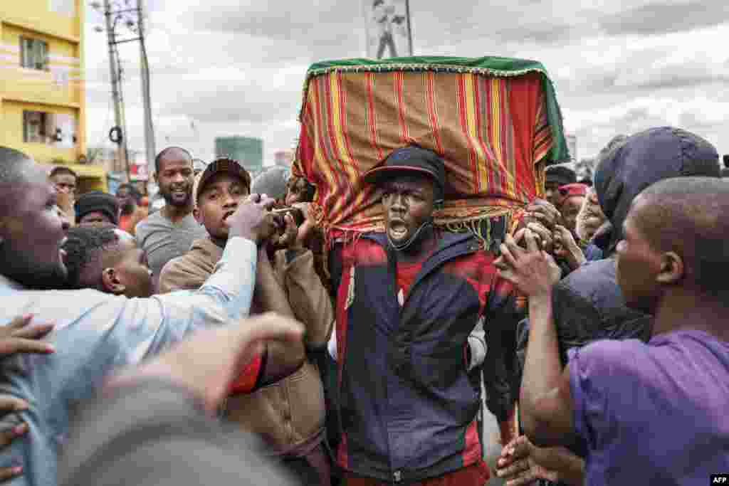Family, friends and fellow protesters carry the body of Ibrahim Kamau, 19, in a procession as they chant slogans to show their respects in the streets of Nairobi.&nbsp;Kamau was killed at the Kenyan Parliament during the nationwide protest against a controversial now-withdrawn tax bill that left over 20 dead and shocked the East African nation.