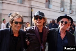 FILE - Rolling Stones band members Mick Jagger, Keith Richards and Ronnie Wood attend a launch event for their new album "Hackney Diamonds", at Hackney Empire in London, Sept. 6, 2023.