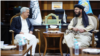 FILE - Pakistan’s Secretary Interior Muhammad Khurram Agha, left, talks with Taliban Deputy Minister for Interior Muhammad Nabi Omari, in Afghanistan, May 30, 2024. (Photo courtesy of Afghan Interior Ministry)