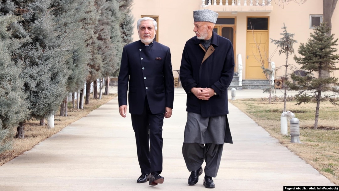 Abdullah Abdullah, left, and Hamid Karzai have remained in Kabul, Afghanistan, since the Taliban seized power.