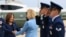 Vice President Kamala Harris, left, is greeted by Democratic Sen. Tammy Baldwin of Wisconsin before boarding Air Force Two to depart on campaign travel to Milwaukee, July 23, 2024 at Andrews Air Force Base, Maryland.