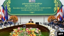 Cambodia's Prime Minister Hun Manet (C) speaks as he holds the first cabinet meeting after his election, at the Peace Palace in Phnom Penh on August 24, 2023. 