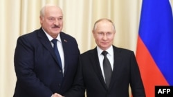 FILE - Russian President Vladimir Putin (R) meets with his Belarusian counterpart Alexander Lukashenko at the Novo-Ogaryovo state residence, outside Moscow, Feb. 17, 2023. (Photo by Vladimir Astapkovich / Sputnik / AFP)