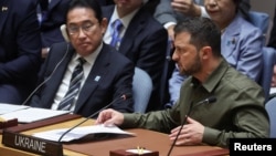 Ukraine President Volodymyr Zelenskyy addresses the U.N. Security Council while sitting next to Japan's Prime Minister Fumio Kishida during a meeting on the crisis in Ukraine at U.N. headquarters, Sept. 20, 2023.