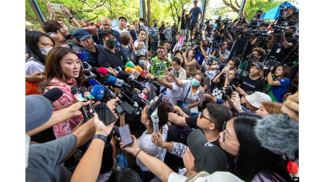 Paetongtarn Shinawatra, left, one of the prime minister candidates from Pheu Thai Party, speaks to media after she cast her vote at a polling station in Bangkok, Thailand, May 14, 2023.