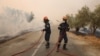 Firefighters battle a wildfire raging in Alexandroupolis, in Greece's Evros region, Aug. 22, 2023.