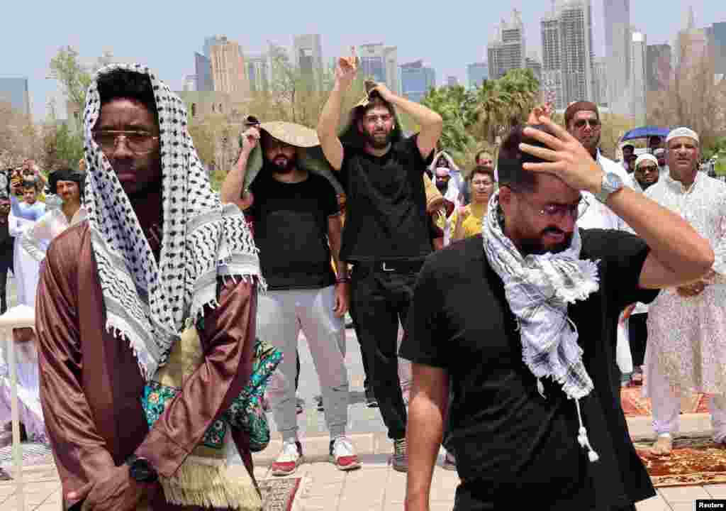 Worshippers attend funeral prayers for assassinated Hamas chief Ismail Haniyeh on the day of Haniyeh's burial, at Imam Muhammad ibn Abd al-Wahhab Mosque, in Doha, Qatar.