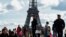 FILE - French police patrol at the Trocadero Square near the Eiffel Tower in Paris, Oct. 15, 2023. 