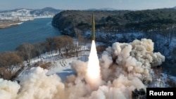 A ballistic missile, said to be solid-fuel and hypersonic, launches during a test at an unspecified location in North Korea in this picture released by the Korean Central News Agency on January 14, 2024. (KCNA via REUTERS)