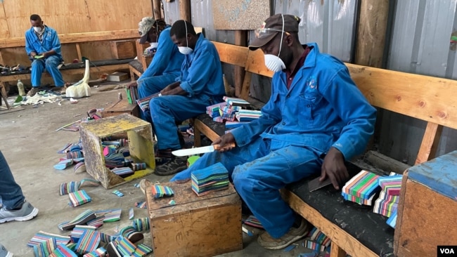 Artist carvers upcycle components of discarded flip-flops, at Ocean Sole, in Karen, Kenya, Jan. 17, 2024. (Mariama Diallo/VOA)