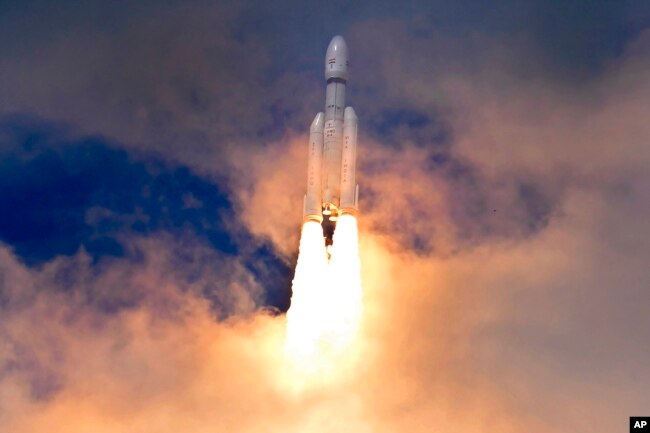 FILE - Indian spacecraft Chandrayaan-3, the word for "moon craft" in Sanskrit, travels after it was launched from the Satish Dhawan Space Centre in Sriharikota, India, Friday, July 14, 2023. (AP Photo/Aijaz Rahi) Keep aspect ratio