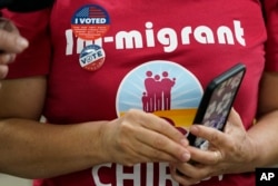 FILE - First-time voter Betty Rodarte wears an "I voted sticker," after casting her ballot at a Los Angeles County participating Flex Voting Center at the offices of the Coalition for Humane Immigrant Rights in Los Angeles, Nov. 5, 2022.