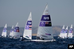 Thad Lettsome of the British Virgin Islands, foreground, competes in a men's dinghy race during the 2024 Summer Olympics on Aug. 1, 2024, in Marseille, France.