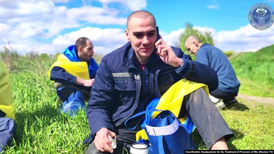 Ukrainian POW on phone at undisclosed location after being released from Russia, May 6, 2023.