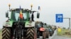 Romanian farmers line up their tractors en route to Nadlac Customs while protesting over the price of grains, in Remetea Mare, Timis county, Romania, April 7, 2023. (Inquam Photos/Cornel Putan via Reuters)