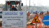 FILE - Asian laborers of the Saudi National Water Company working at a construction site in a road in the capital Riyadh. Saudi Arabia. (Fayez Nureldine / AFP)
