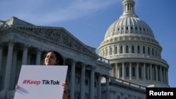 FILE - Giovanna Gonzalez of Chicago demonstrates as Congress weighs a crackdown on TikTok, on Capitol Hill in Washington, March 12, 2024.
