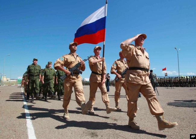 FILE - Russian soldiers participate in a joint exercise by the Shanghai Cooperation Organization in Khujand, Tajikistan, June 9, 2012. The drill involved personnel from China, Russia, Kazakhstan, Kyrgyzstan, Tajikistan and Uzbekistan. (Xinhua via AP)