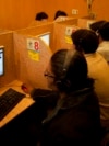 FILE - People use the internet at a local cafe in Islamabad, Pakistan, March 7, 2012. Pakistan said July 26, 2024, that it is implementing an internet firewall, which critics and digital rights activists worry will be used to silence dissent.