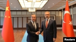 FILE - Turkish Foreign Minister Hakan Fidan meets with Chinese Foreign Minister Wang Yi in Ankara, Turkey, July 26, 2023. Fidan wrapped up a three-day visit to China on June 5, 2024. (Pool via Reuters)