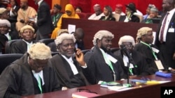 Lawyers from the Independent National Electoral Commission attend the Presidential election petition tribunal in Abuja, Nigeria, Sept. 6, 2023. The tribunal upheld the February election of Bola Tinubu. 