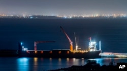 FILE - The Russian vessel Lady R is docked at the Simon's Town Naval Base near Cape Town, South Africa, Dec. 8, 2022. 