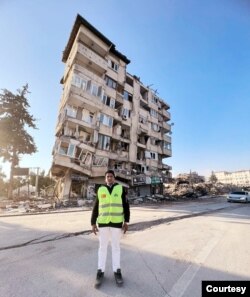 Aung Naing Shwe in front of a damaged building in Turkey. (Courtesy Aung Naing Shwe)