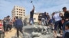 Palestinians look for survivors in buildings destroyed by Israeli airstrikes in Deir el-Balah, southern Gaza Strip, Oct. 17, 2023.