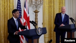 U.S. President Joe Biden listens as Britain's Prime Minister Rishi Sunak addresses a joint news conference in the East Room at the White House in Washington, June 8, 2023.