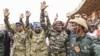 FILE - Nigerien military leaders wave to supporters at the General Seyni Kountche Stadium in Niamey, Niger, Aug. 26, 2023. 