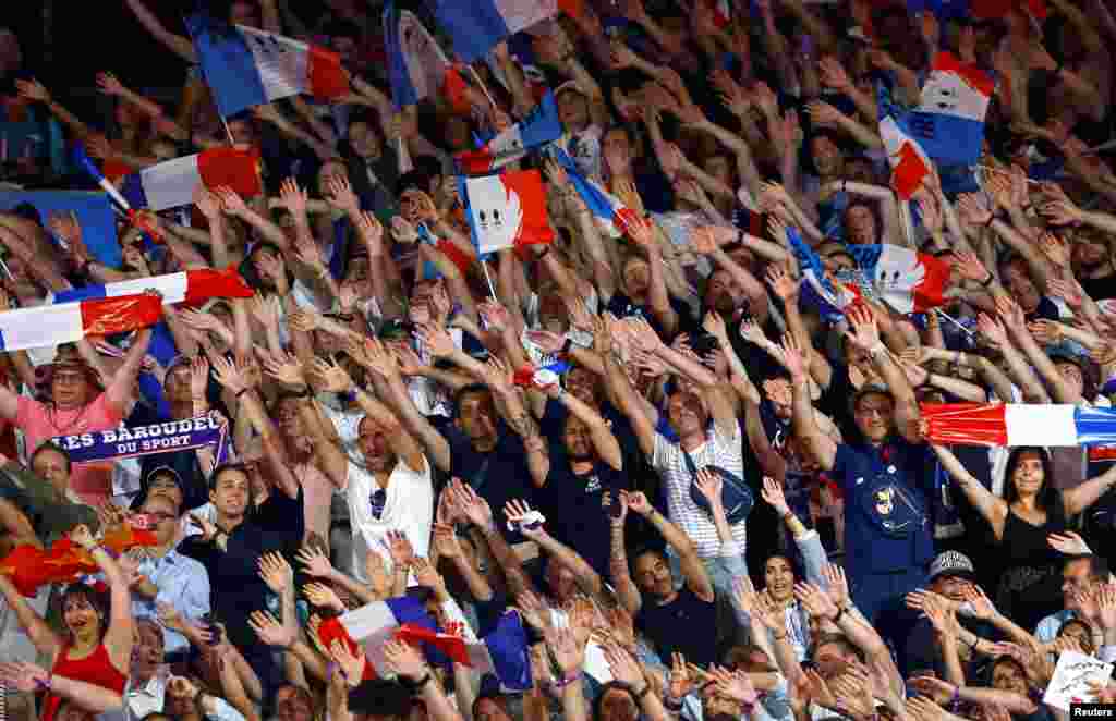 Spectators cheer before the matches begin in women's judo at the Champ de Mars Arena, Paris, France, during the 2024 Olympic Games.