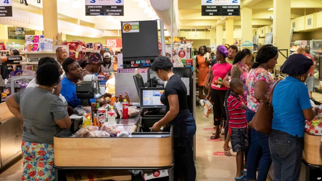 Costumers purchase groceries ahead of Hurricane Beryl in Arnos Vale, St. Vincent and the Grenadines, June 30, 2024.