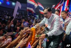 Thailand's Prime Minister Prayuth Chan-ocha greets supporters, during a final general election campaign rally in Bangkok, May 12, 2023.