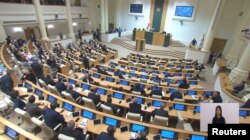 Lawmakers attend a plenary session of parliament where they vote on controversial "foreign agents" bill, in Tbilisi, Georgia, March 10, 2023, in this still image taken from video. (Parliament of Georgia/Handout via Reuters)