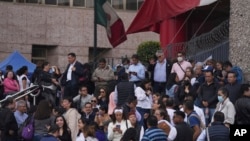 Unionized federal court workers gather outside a federal court as they strike over reforms that would make all judges stand for election in Mexico City, Aug. 19, 2024. 