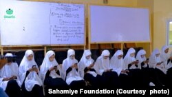 In this handout photo provided by the Sahamiye Foundation, high school girls are seen participating in the ''Daariz'' speed reading competition held in Hargeysa, Somaliland.