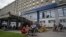 Ukrainian army veterans rest with their families and comrades outside St. Panteleimon hospital in Lviv, Ukraine, July 25, 2023.